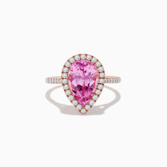 The 14K Rose Gold Kunzite and Diamond Ring features a pear-shaped pink kunzite center stone, surrounded by a halo of small white diamonds, set in a rose gold band and photographed on a plain white background.