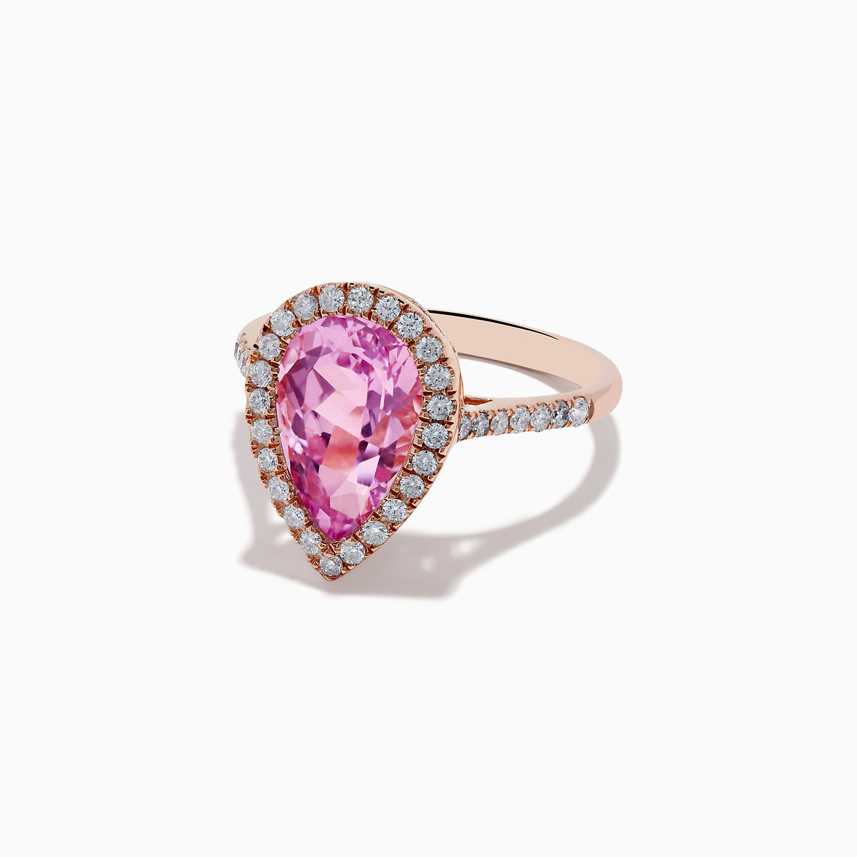 The 14K Rose Gold Kunzite and Diamond Ring features a pear-shaped pink kunzite center stone, surrounded by a halo of small white diamonds, set in a rose gold band and photographed on a plain white background.