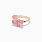 The 14K Rose Gold Rose Quartz and Diamond Butterfly Ring showcases a pink butterfly with gemstone accents and hints of rose quartz, set against a white background.