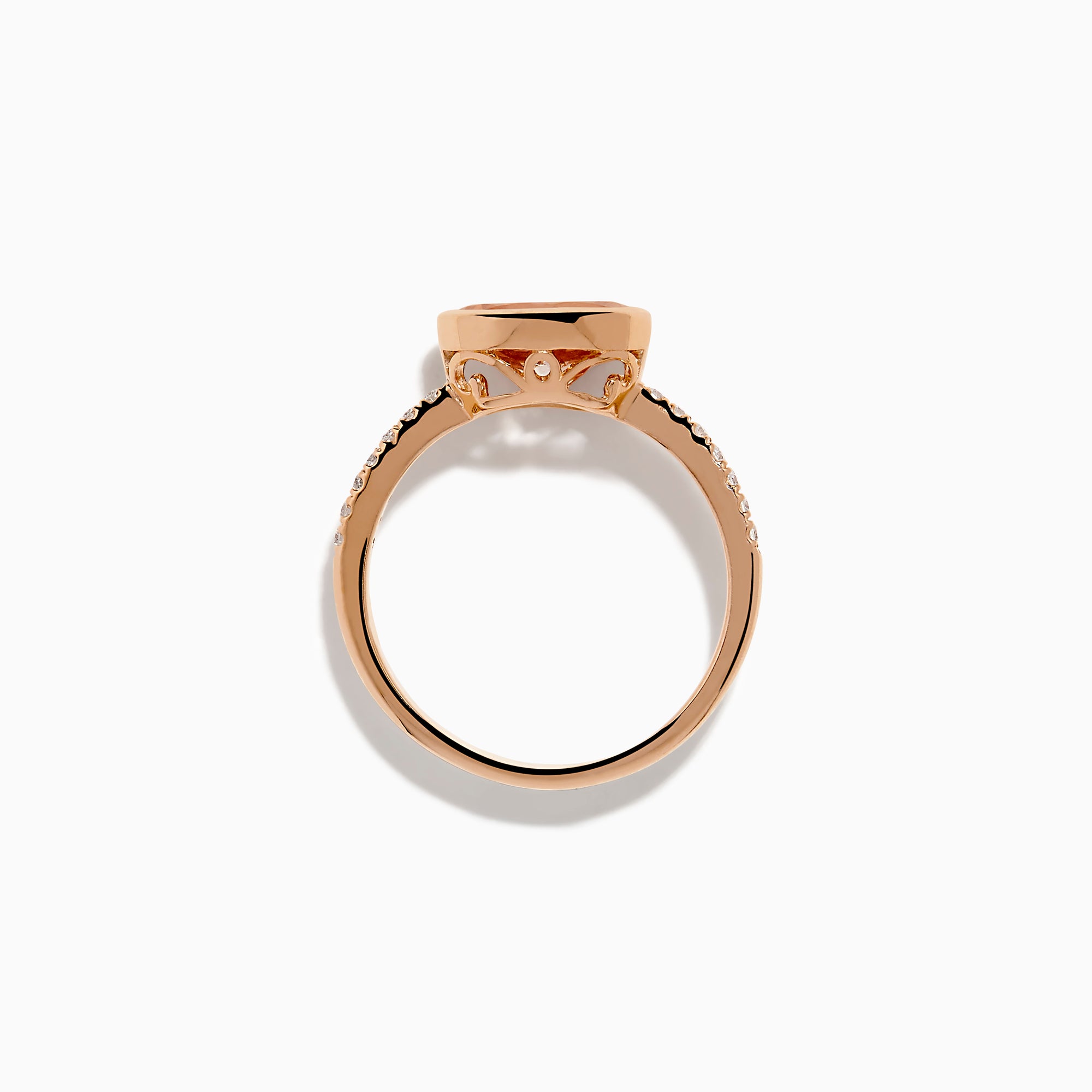 The 14K Rose Gold Morganite and Diamond East West Bezel Ring showcases a striking round peach morganite center stone with small diamonds along the band, set against a white background.