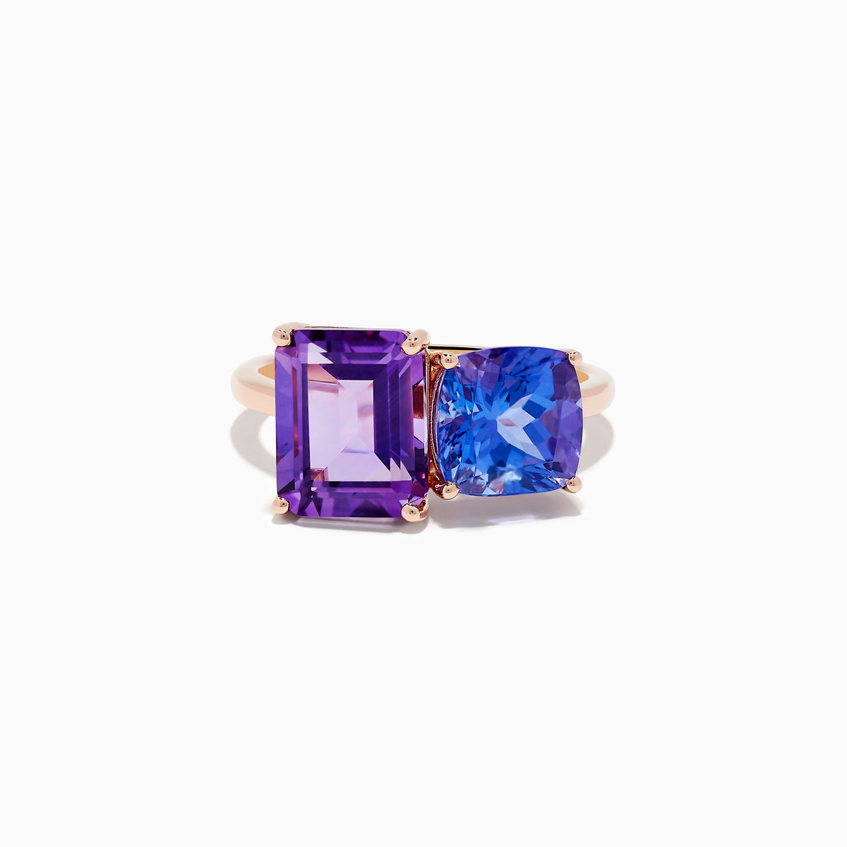 The 14k Rose Gold Amethyst and Tanzanite Toi Et Moi Ring features a rectangular purple amethyst and a cushion-cut blue tanzanite side by side on a minimalist band, displayed against a white background.