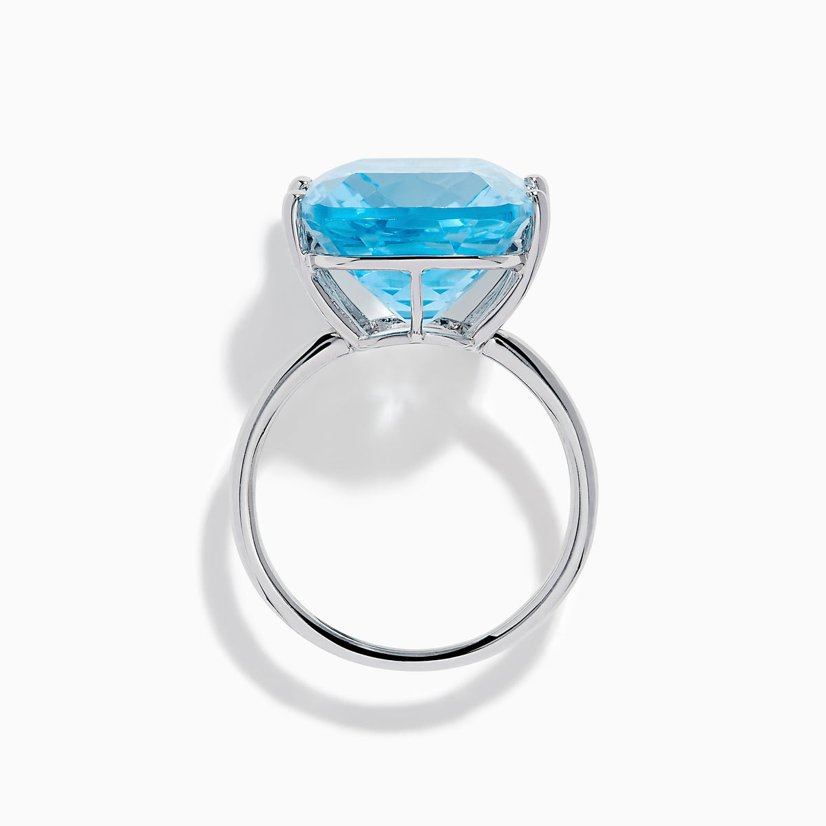 The Ocean Bleu 14K White Gold Sky Blue Topaz Ring features a large cushion-cut gemstone, showcased against a plain white background.