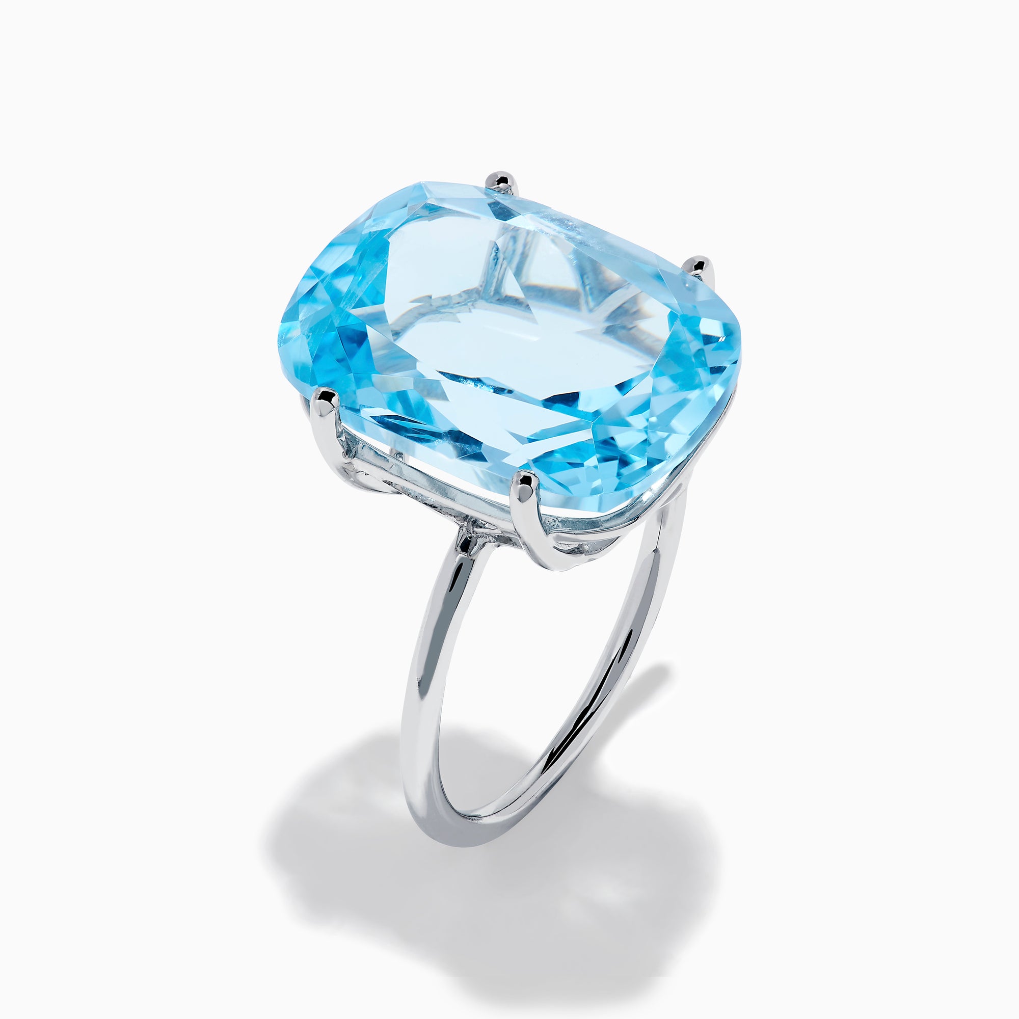 The Ocean Bleu 14K White Gold Sky Blue Topaz Ring features a large cushion-cut gemstone, showcased against a plain white background.