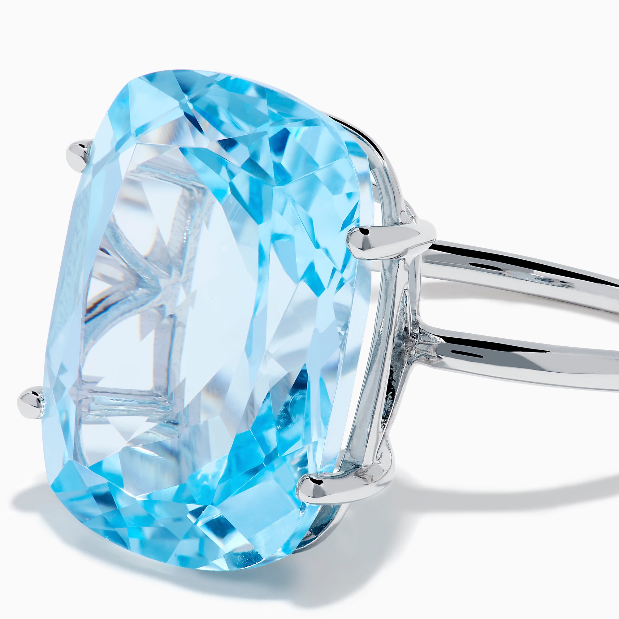 The Ocean Bleu 14K White Gold Sky Blue Topaz Ring features a large cushion-cut gemstone, showcased against a plain white background.