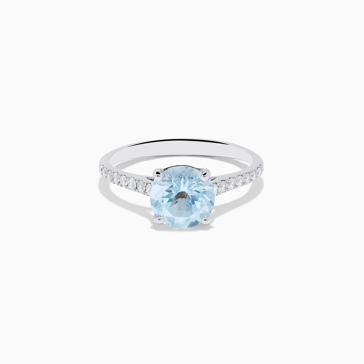 The Aquarius 14K White Gold Aquamarine and Diamond Ring showcases a large oval aquamarine centerpiece with sparkling diamonds along the band, elegantly displayed on a plain white background.