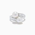 A 14K white gold ring featuring two fresh water pearls and a split band accented with diamonds, displayed on a white background.
