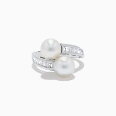 A 14K white gold ring featuring two fresh water pearls and a split band accented with diamonds, displayed on a white background.