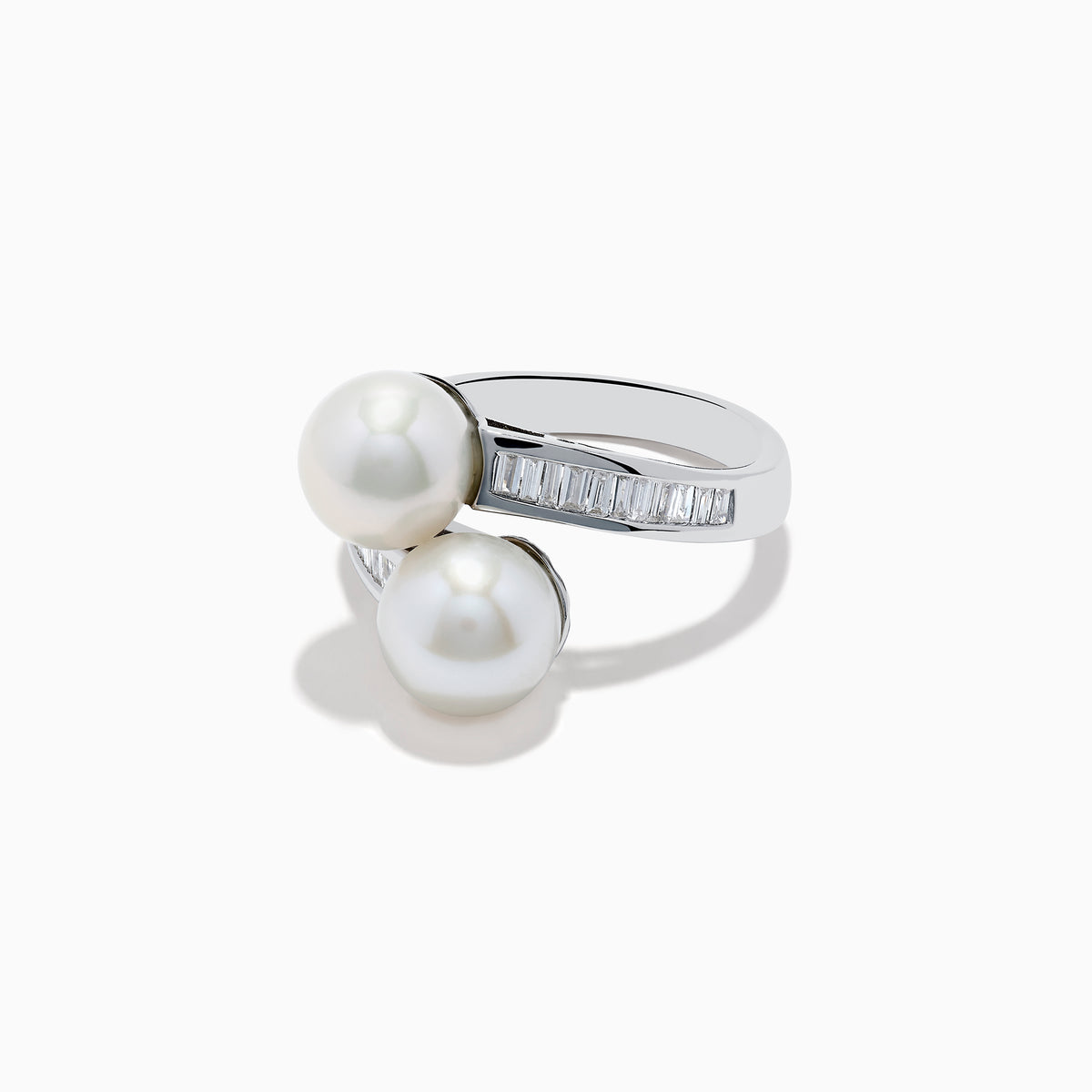 A 14K white gold ring featuring two fresh water pearls and a split band accented with diamonds, displayed on a white background.