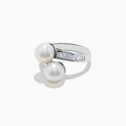 A 14K white gold ring featuring two fresh water pearls and a split band accented with diamonds, displayed on a white background.