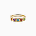 The 14K Yellow Gold Multi Colored Gemstone Band features five square gemstones—orange, purple, blue, red, and green—set in a vibrant row across the yellow gold band.