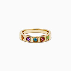 The 14K Yellow Gold Multi Colored Gemstone Band features five square gemstones—orange, purple, blue, red, and green—set in a vibrant row across the yellow gold band.