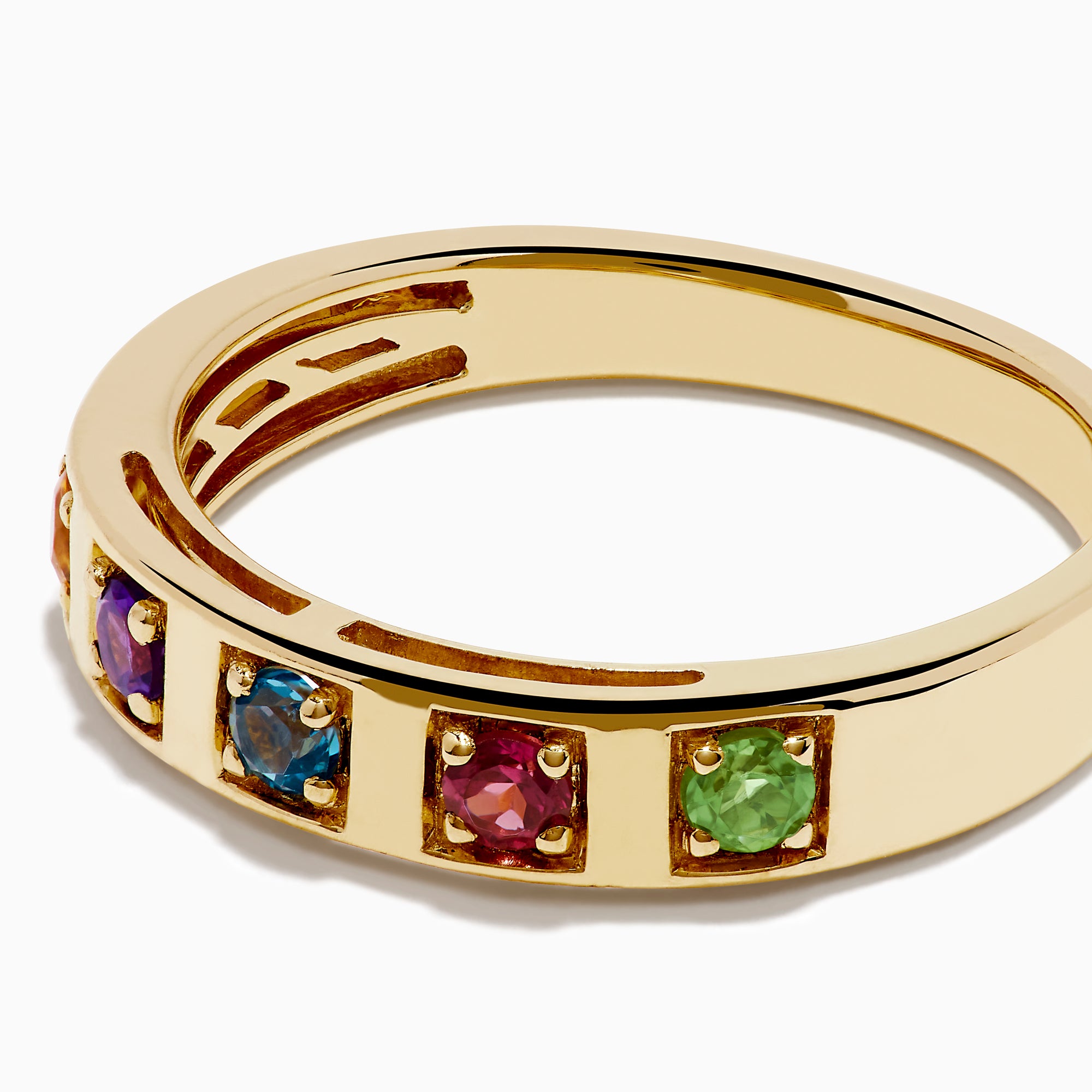 The 14K Yellow Gold Multi Colored Gemstone Band features five square gemstones—orange, purple, blue, red, and green—set in a vibrant row across the yellow gold band.