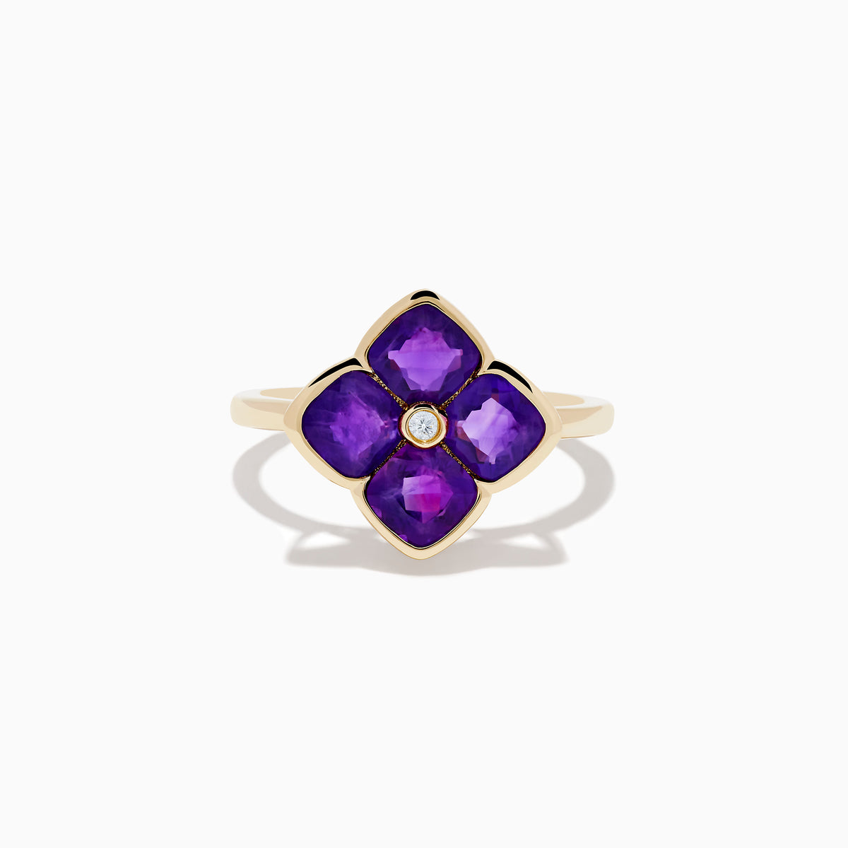 The 14K Yellow Gold Amethyst and Diamond Ring showcases a flower motif with four amethyst petals and a central round diamond, set against a white background.