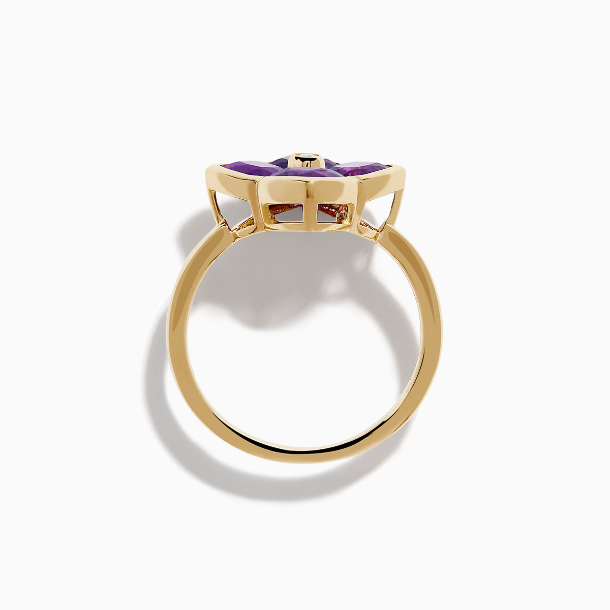 The 14K Yellow Gold Amethyst and Diamond Ring showcases a flower motif with four amethyst petals and a central round diamond, set against a white background.