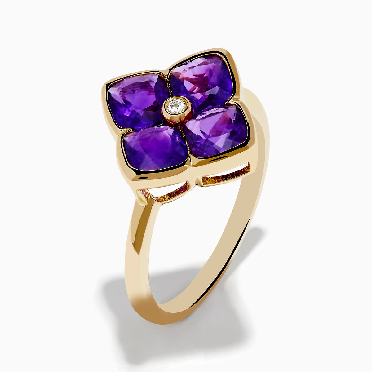 The 14K Yellow Gold Amethyst and Diamond Ring showcases a flower motif with four amethyst petals and a central round diamond, set against a white background.