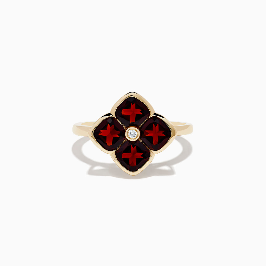 A 14K yellow gold ring featuring a red clover-shaped design in garnet with four gold-outlined petals and a small round diamond at the center.