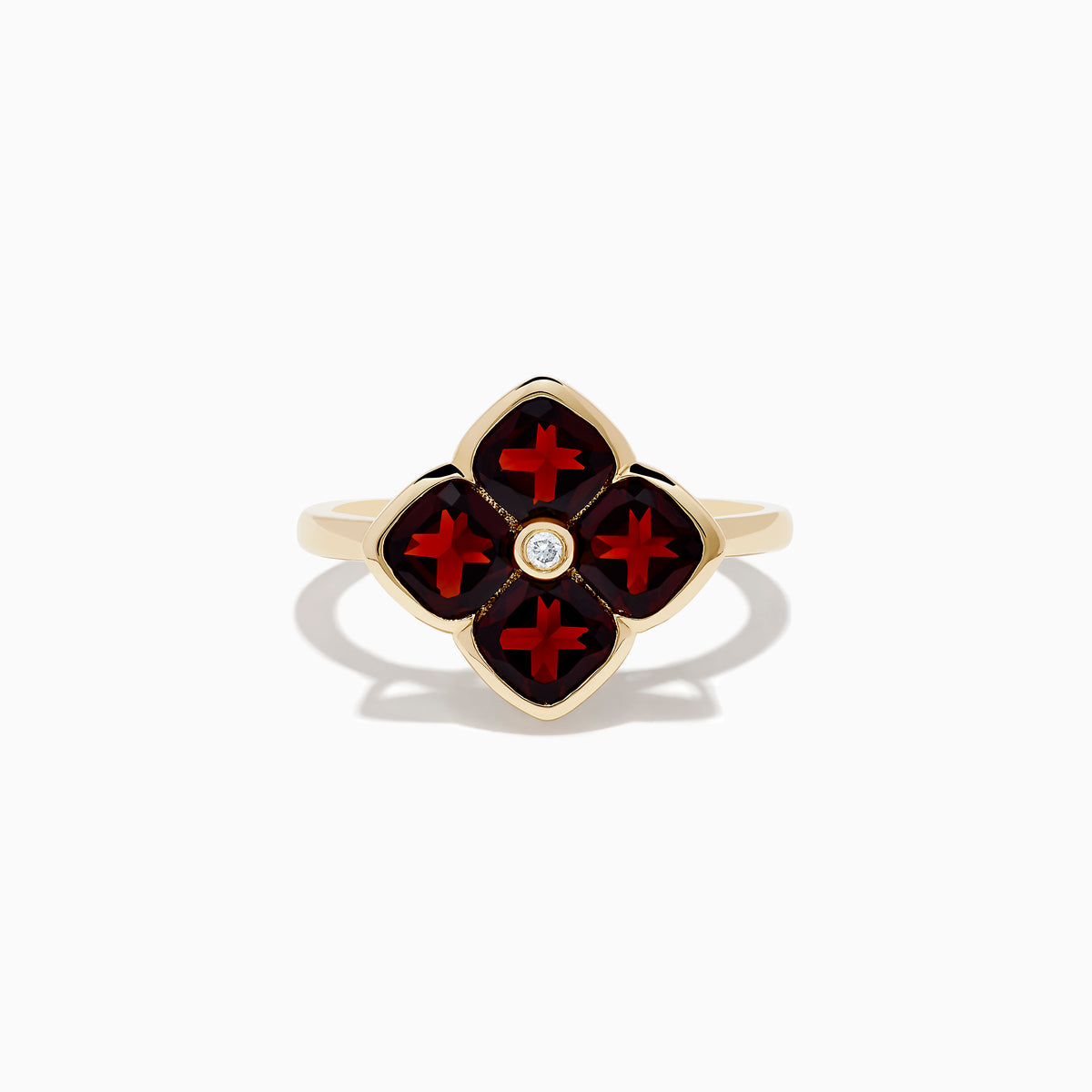 A 14K yellow gold ring featuring a red clover-shaped design in garnet with four gold-outlined petals and a small round diamond at the center.