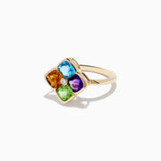 The Mosaic 14K Yellow Gold Multi Color Gemstone and Diamond Ring features blue, orange, purple, and green gemstones in a floral pattern with a central round white gemstone.