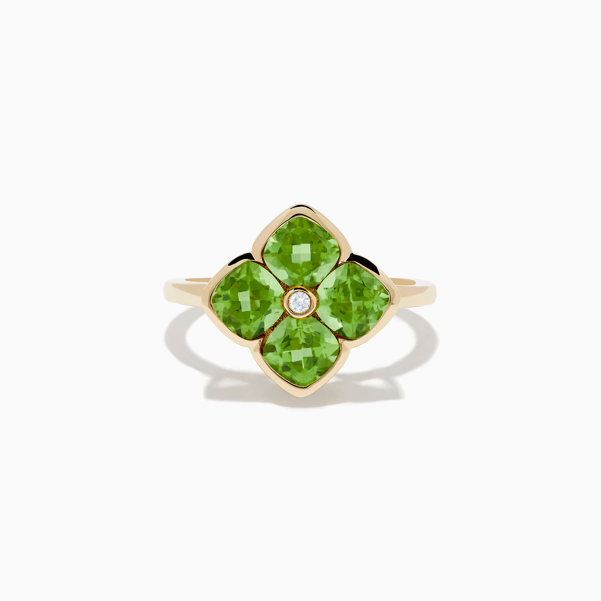 The 14K Yellow Gold Peridot and Diamond Ring displays a clover-shaped design with four faceted green peridots and a central round diamond, shown against a white background.