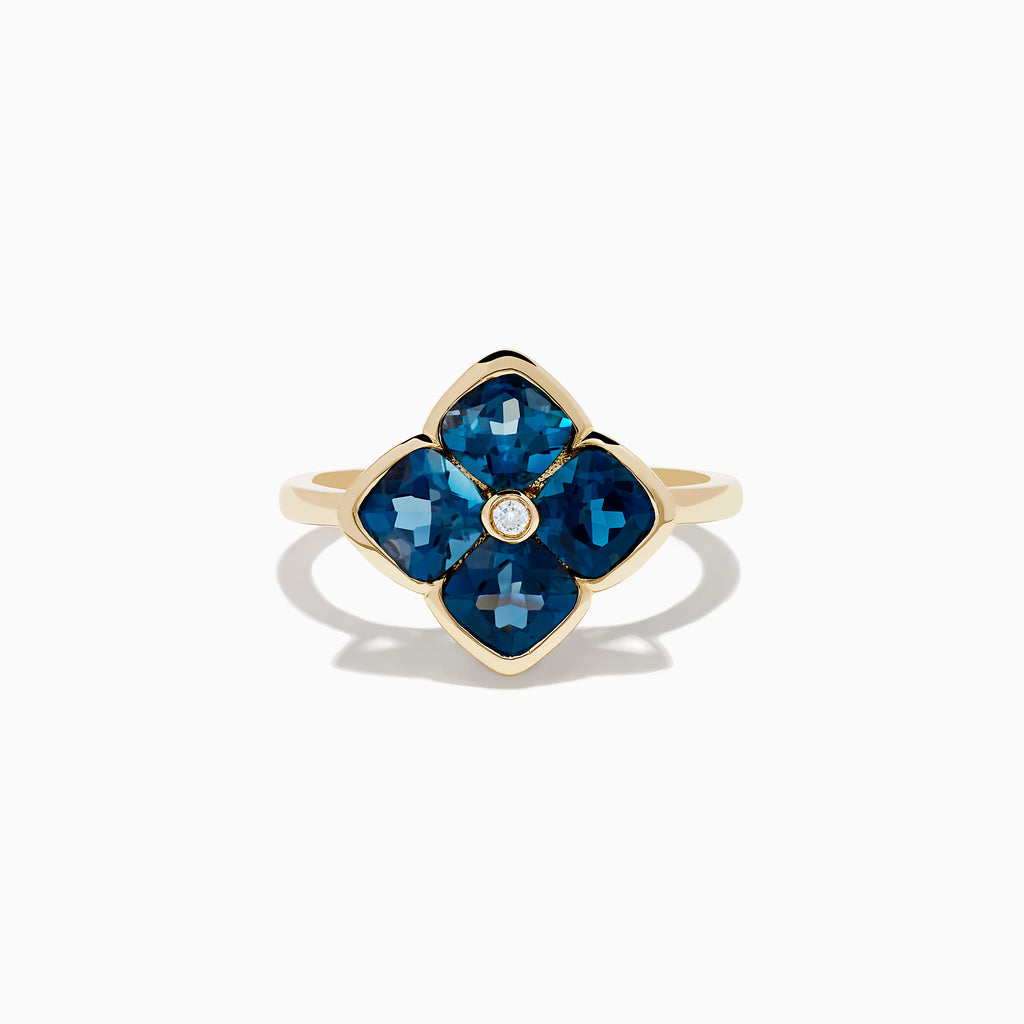 The Ocean Bleu 14K Yellow Gold London Blue Topaz and Diamond Ring showcases a clover design with four London Blue Topaz stones and a central round diamond, set against a white background.