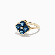 The Ocean Bleu 14K Yellow Gold London Blue Topaz and Diamond Ring showcases a clover design with four London Blue Topaz stones and a central round diamond, set against a white background.