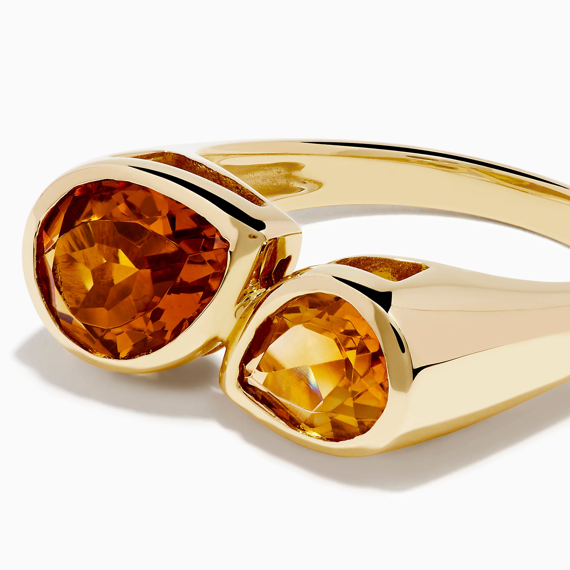The Sunset 14K Yellow Gold Citrine Bypass Ring showcases two pear-shaped citrine gemstones set side by side on a yellow gold band.