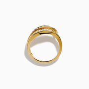 The 14K Yellow Gold Garnet and Diamond Wavy Band features a unique design with one band set with rectangular garnets and the other adorned with round white diamonds.