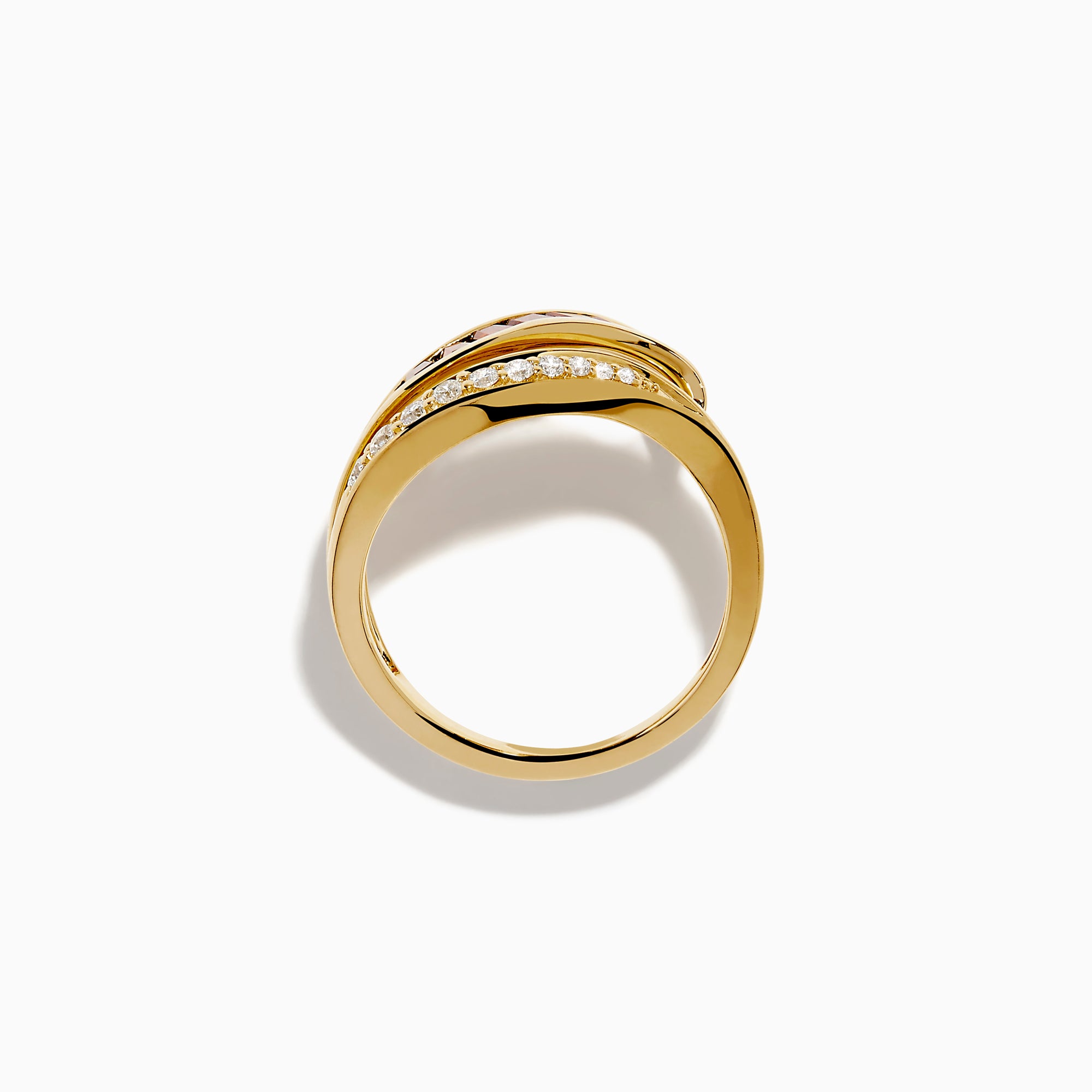 The 14K Yellow Gold Garnet and Diamond Wavy Band features a unique design with one band set with rectangular garnets and the other adorned with round white diamonds.
