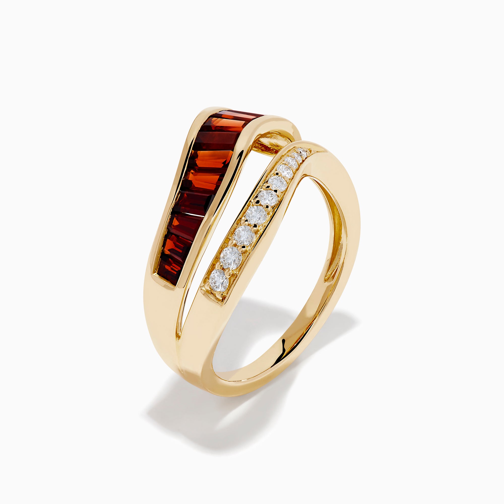 The 14K Yellow Gold Garnet and Diamond Wavy Band features a unique design with one band set with rectangular garnets and the other adorned with round white diamonds.