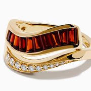 The 14K Yellow Gold Garnet and Diamond Wavy Band features a unique design with one band set with rectangular garnets and the other adorned with round white diamonds.