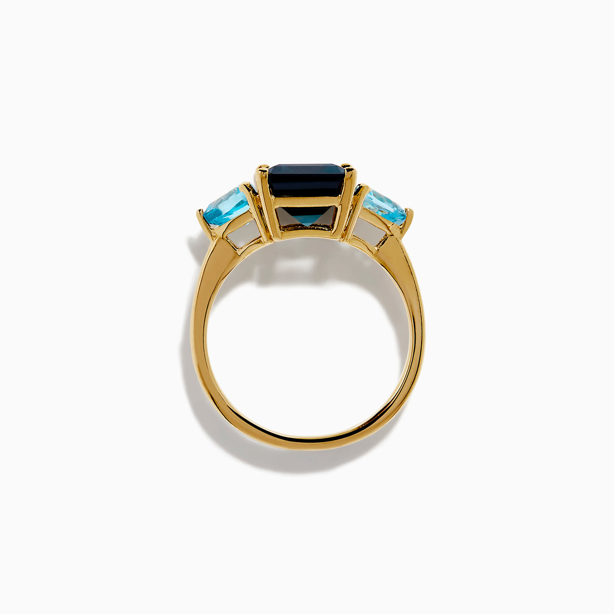 The 14K Yellow Gold Sky Blue and London Blue Topaz 3 Stone Ring features a large rectangular blue topaz flanked by two heart-shaped stones, all set in yellow gold. A stunning piece for any occasion.