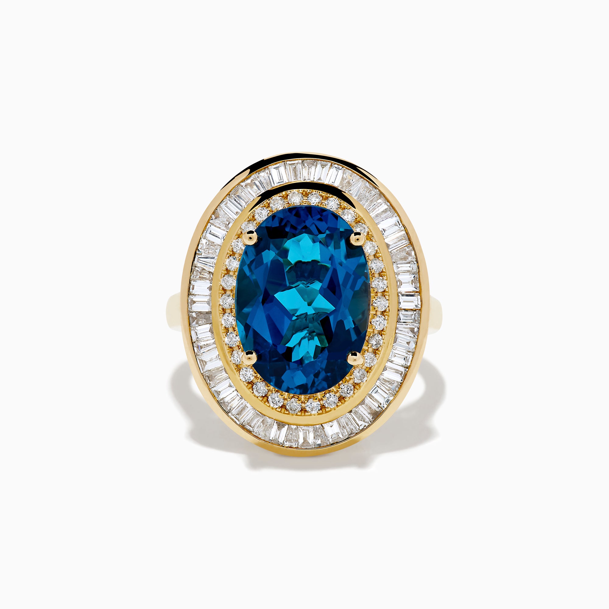 The 14K Yellow Gold London Blue Topaz and Diamond Double Halo Ring features an oval London Blue Topaz at the center, encircled by two halos of sparkling round and baguette-cut diamonds.