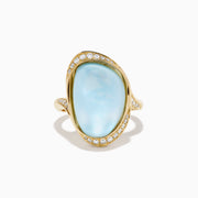 A 14K yellow gold ring featuring a sky blue topaz and mother of pearl doublet, accented with small round diamonds and set against a white background.