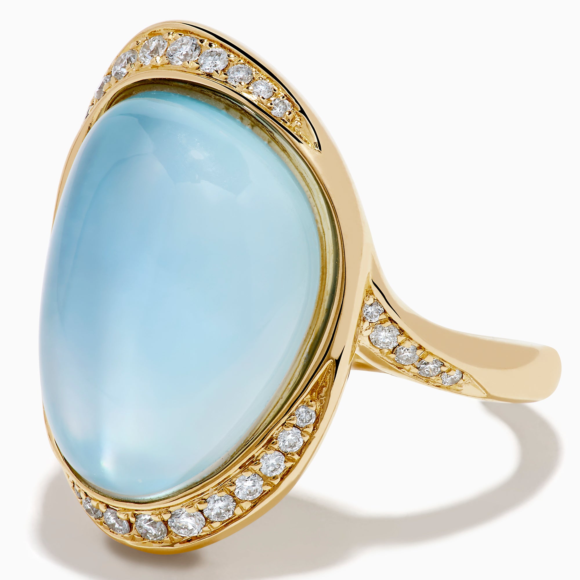 A 14K yellow gold ring featuring a sky blue topaz and mother of pearl doublet, accented with small round diamonds and set against a white background.