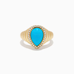 The 14K Yellow Gold Turquoise and Diamond Pear Halo Dome Ring features a teardrop-shaped turquoise center stone, encircled by a sparkling halo of small diamonds in a pear-shaped design, displayed on a white background.