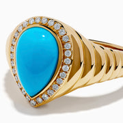 The 14K Yellow Gold Turquoise and Diamond Pear Halo Dome Ring features a teardrop-shaped turquoise center stone, encircled by a sparkling halo of small diamonds in a pear-shaped design, displayed on a white background.