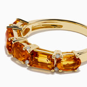 The 14K Yellow Gold Citrine and Diamond Band features five rectangular orange citrine gemstones in prongs on a polished yellow gold band.