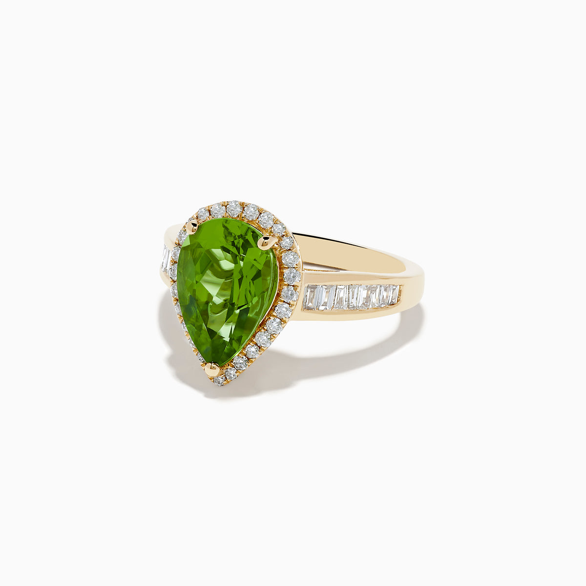 The 14K Yellow Gold Pear Shaped Peridot and Diamond Cocktail Ring features a pear-cut peridot center, a halo of white diamonds, and baguette-cut diamonds along the band for a dazzling, elegant look.
