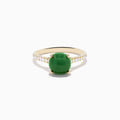 The 14K Yellow Gold Dyed Jade Ring Diamond Ring features a large round dyed jade center stone with small white diamonds set along the band.