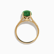 The 14K Yellow Gold Dyed Jade Ring Diamond Ring features a large round dyed jade center stone with small white diamonds set along the band.