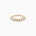 The 14K Yellow Gold Cultured Fresh Water Pearl Band features a row of small, round cultured freshwater pearls set along the top and is shown on a white background.