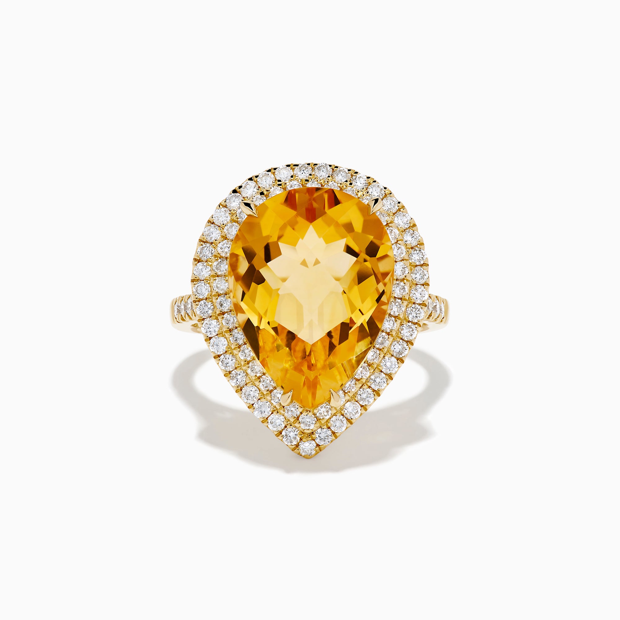 The 14K Yellow Gold Citrine and Diamond Pear Halo Cocktail Ring features a large pear-shaped citrine surrounded by a halo of round diamonds, shown on a white background.