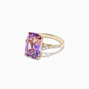 The 14K Yellow Gold Ametrine and Diamond Ring features a vivid purple and pink rectangular ametrine, accented by small round diamonds on each side of the band, shown against a white background.