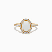 The Aurora 14K Yellow Gold Opal and Diamond Ring showcases an oval opal center, haloed by round diamonds and accented with more diamonds along its elegant band.