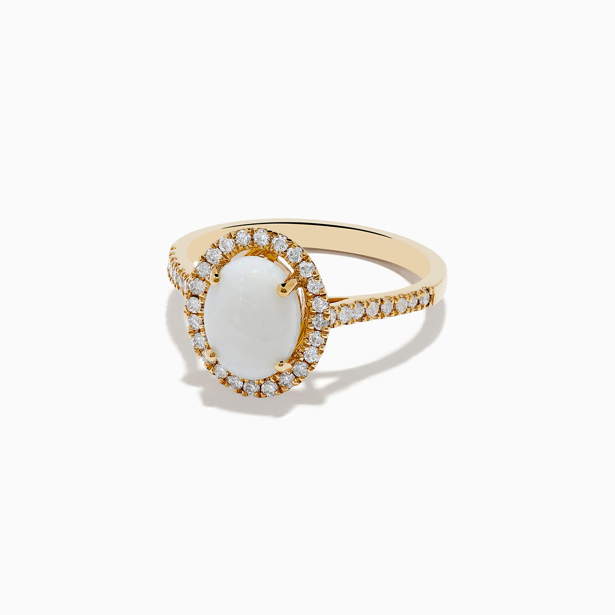 The Aurora 14K Yellow Gold Opal and Diamond Ring showcases an oval opal center, haloed by round diamonds and accented with more diamonds along its elegant band.