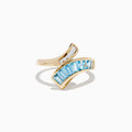 The Ocean Bleu 14K Yellow Gold Blue Topaz and Diamond Bypass Ring features sparkling white diamonds on one side and a row of rectangular blue topaz stones on the other in an elegant bypass design.