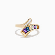 The Mosaic 14K Yellow Gold Multi Color Gemstone and Diamond Bypass Ring features asymmetrical arms set with white diamonds and rectangular multi color gemstones, shown on a white background.