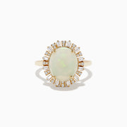 The Aurora 14K Yellow Gold Opal Diamond Ring showcases an oval opal center, encircled by a halo of baguette-cut diamonds, set against a white background.
