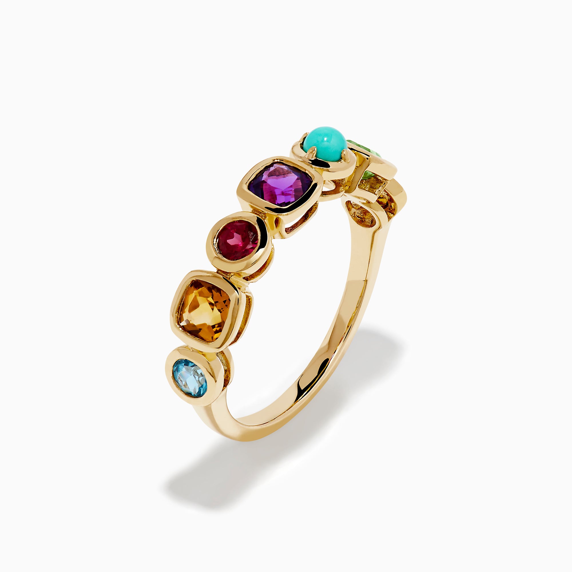 The 14K Yellow Gold Multi Color Gemstone Bezel Band features a row of bezel-set purple, red, turquoise, orange, and green gemstones in various shapes and sizes.