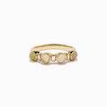The 14K Yellow Gold Opal and Diamond Bezel Band showcases four round opals and three small rectangular diamonds set in a row, displayed on a white background.